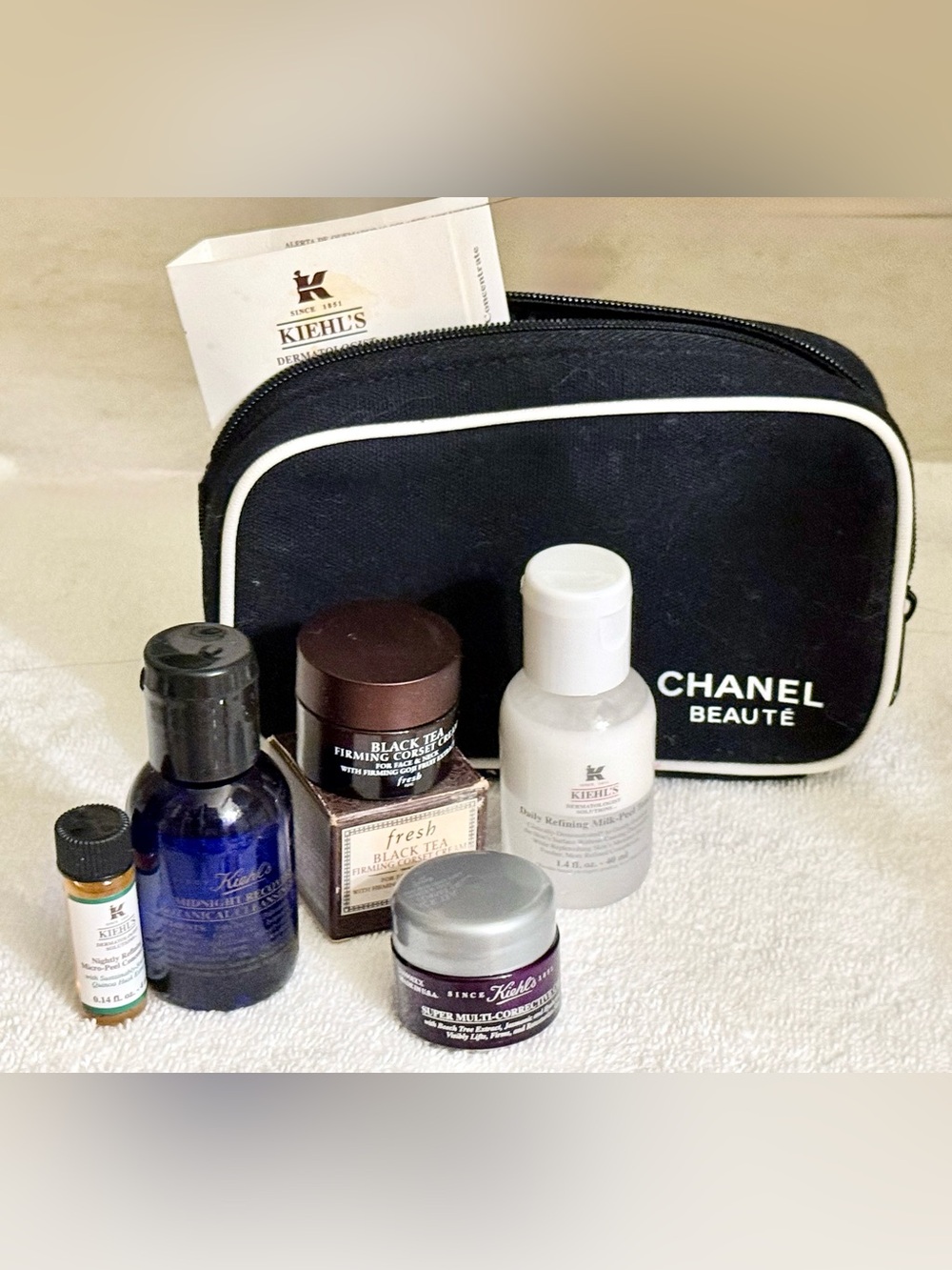CHANEL Black Cosmetic Pouch with Kiehl's & Assorted Skincare